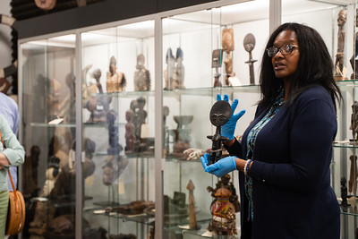 Dr. Rogers presenting pieces from the World Cultures Art Collection.