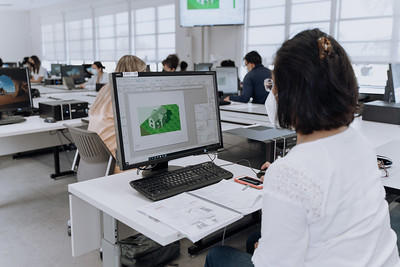 student using computer program for building houses